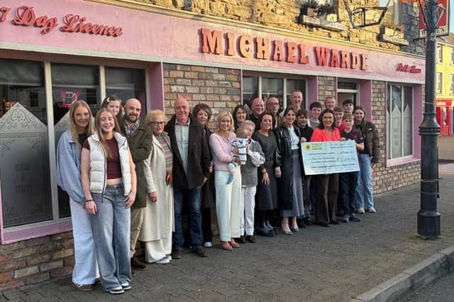 The Warde family gathered together outside Warde's pub for a photo and a cheque handover to the Mayo Roscommon Hospice Foundation