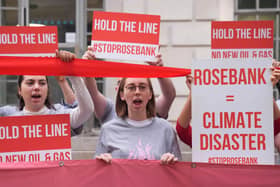 Fossil Free London protesters holding banners