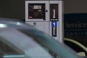 Fuel prices are shown on the pump at 299.9p per litre of diesel