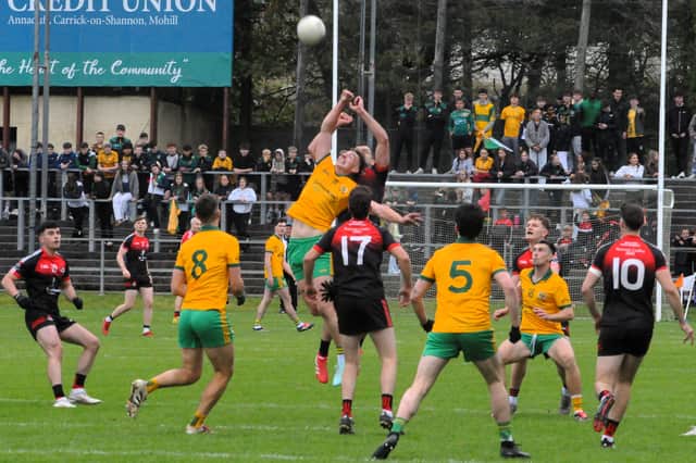 The battle for possession in the middle of the park during the drawn Connacht Gold Leitrim SFC Final - the replay will see an equally tough battle next Saturday Picture: Willie Donnellan