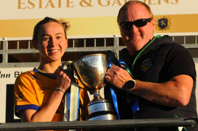Glencar Manorhamilton captain Aoife Gilmartin is presented with the Cup by Leitrim LGFA chairperson Liam O'Neill last Saturday Picture: Willie Donnellan