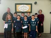 Pictured are students from St. Patrick's & St. Joseph's Primary School with Phelim Sharvin, Head of Community Finance (Northern Ireland) with Community Finance Ireland and Principal Catherine Ball.