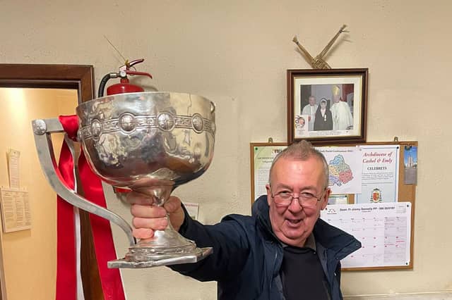 The late Michael Reale lifting the Daly Cup in the church sacristy after Doon’s historic first county final win