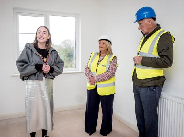 Mayor of Derry City and Strabane District Council, Cllr Grace Uí Niallais, views one of the homes nearing completion at The Cashel alongside Sheena McCallion, Chief Executive of Apex Housing Association, and Patrick McGinnis, Chairman of the Braidwater Group.