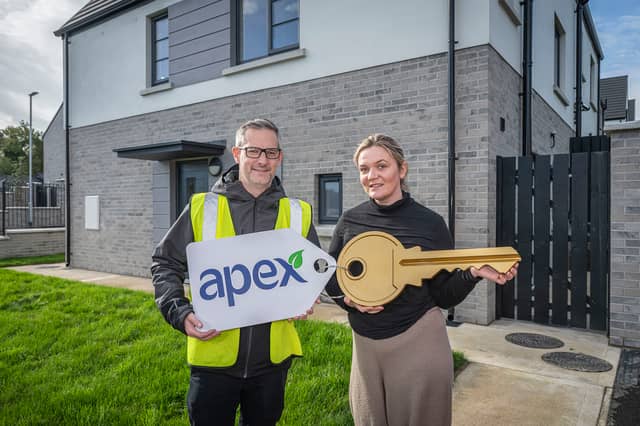 Jennifer Lindsay received the keys to her new home in Maple Glen at The Cashel recently and says it's been life-changing for her family. Pictured with Joe Doherty from Apex Housing Association.