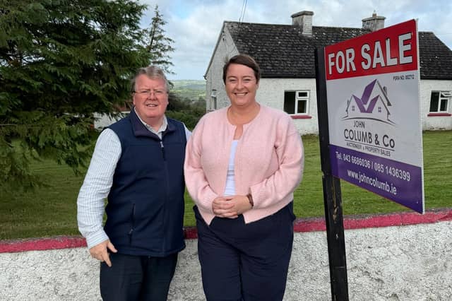 Longford auctioneer John Columb pictured with presenter of RTÉ’s Cheap Irish Homes, Maggie Molloy