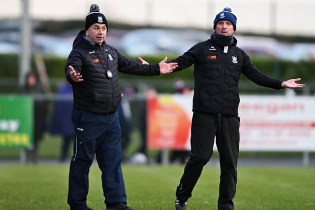 Monaghan manager Gabriel Bannigan, left, and selector Andy McEntee, the new Longford manager, during the Allianz Football League Division 1 match between Monaghan and Galway at Grattan Park in Inniskeen on March 15, 2026