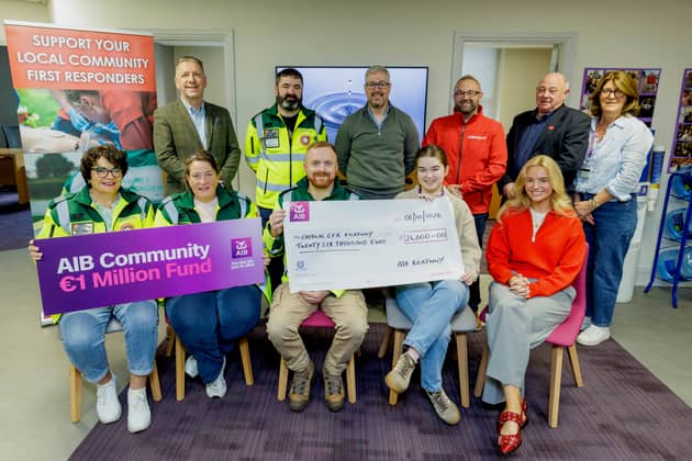  David Tighe CEO CRITICAL; Tadhg O'Shea CRITICAL CFR Kilkenny responder; Jason Dempsey AIB; Edward Walsh and Donnie Lucey CRITICAL; and Cathriona Murphy AIB. Front from left are Anne Reilly, Kathleen O'Carroll and Stephen Happe, CRITICAL CFR Kilkenny responders with Robyn Kehoe and Eabha Heffernan AIB. Picture Dylan Vaughan  