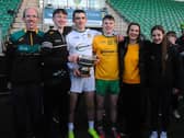 Ballinamore Sean O’Heslin’s Goalkeeper Mark Aherne holding the Fenagh cup with his family after the club's Leitrim Senior Championship Final win on Sunday.  