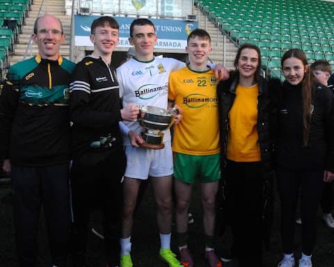 Ballinamore Sean O’Heslin’s Goalkeeper Mark Aherne holding the Fenagh cup with his family after the club's Leitrim Senior Championship Final win on Sunday.  