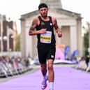Stephen McAuley crossing the finish line at the 2026 Dublin Marathon