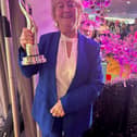Rena Donaghey, Chairperson of Buncrana Tidy Towns, pictured with the trophy after Buncrana was crowned Ireland’s Tidiest Large Town for 2026 at the SuperValu TidyTowns awards.