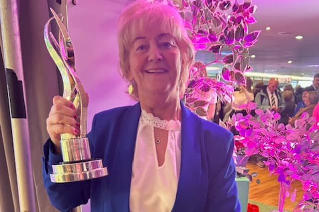 Rena Donaghey, Chairperson of Buncrana Tidy Towns, pictured with the trophy after Buncrana was crowned Ireland’s Tidiest Large Town for 2026 at the SuperValu TidyTowns awards.