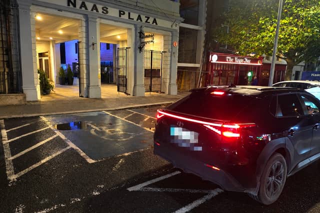 Car illegally parked on disabled parking space