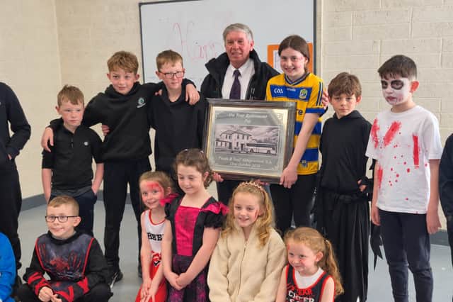 Pat McGarry pictured with some of the children who travelled on his school bus following his retirement after 19 years serving the Elphin route.