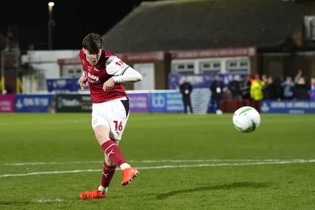 Fleetwood’s Conor Haughey slams home the decisive penalty in the shootout win over Arsenal (Nick Potts/PA)