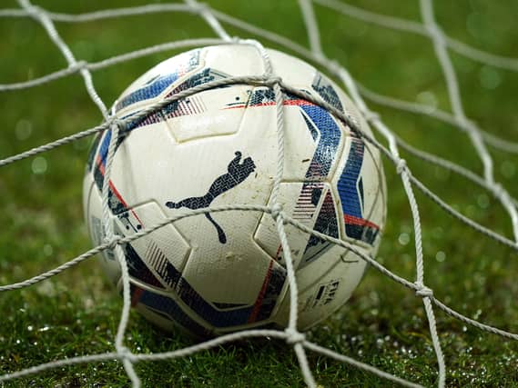 A view of a match ball in a net