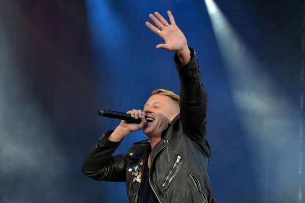 Macklemore performing on stage