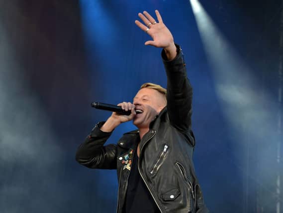 Macklemore performing on stage