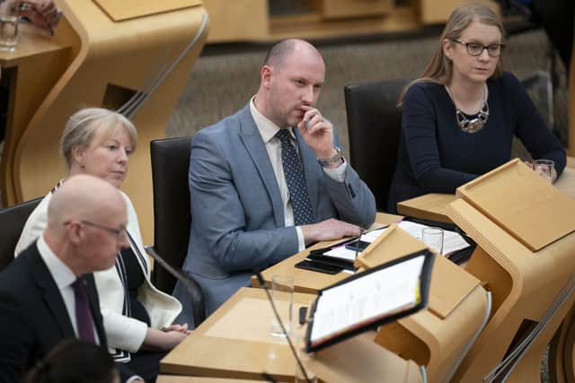 Justice Secretary Neil Gray (centre) stressed the government’s ‘absolute determination’ to tackle violence against women and girls (Jane Barlow/PA)