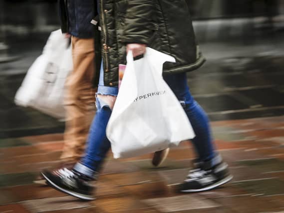 Shoppers holding carrier bags on Buchanan Street in Glasgow
