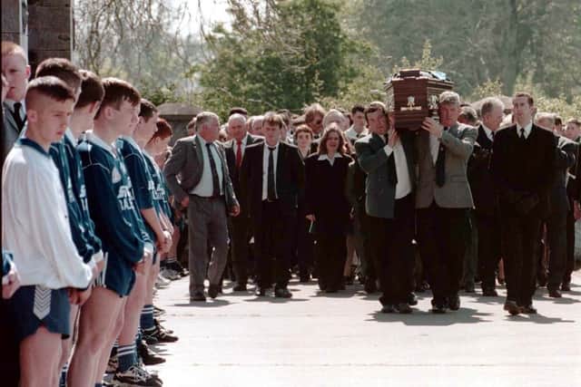 The coffin of Sean Brown, 61, is carried during his funeral (PA)