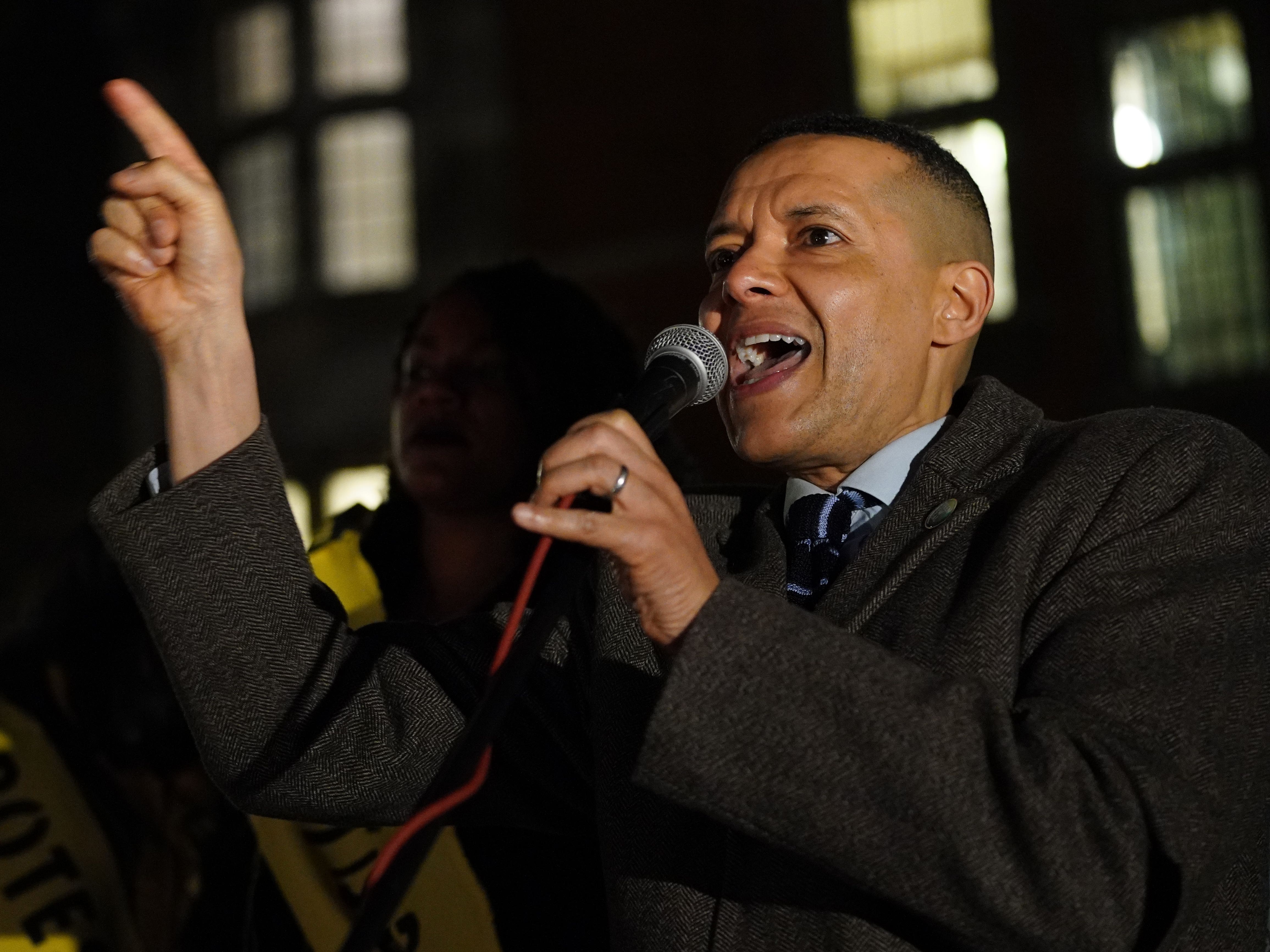 Clive Lewis speaking into a microphone and pointing