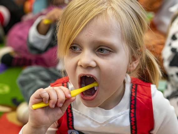 A child brushing teeth