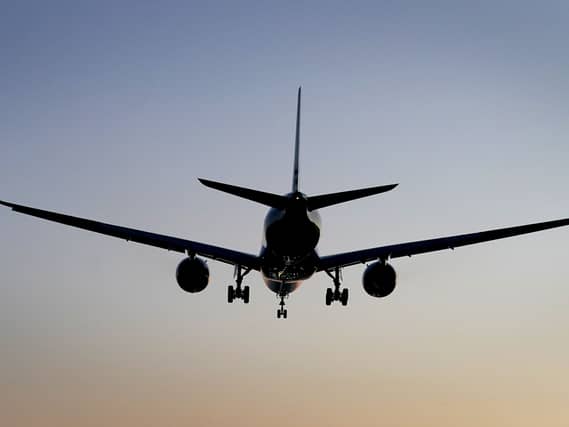 Silhouette of a plane in the sky