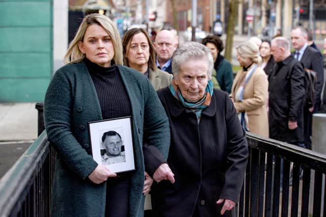 Clare Loughran (left) and her mother Bridie Brown (right) holding a picture of her father Sean Brown (Liam McBurney/PA)