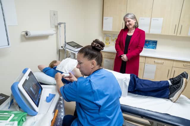 Minister for Drugs and Alcohol Policy Maree Todd watches nurse specialists Iricka King (left) and Angela Morton (centre) demonstrate a fibro scanner, which checks liver health (Jane Barlow/PA)