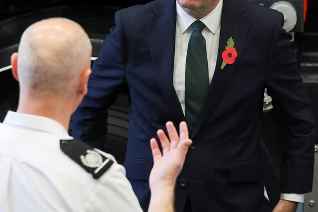 Prime Minister Andy Burnham meets a member of the fire services during England’s first wildfire resilience summit (Temilade Adelaja/PA)