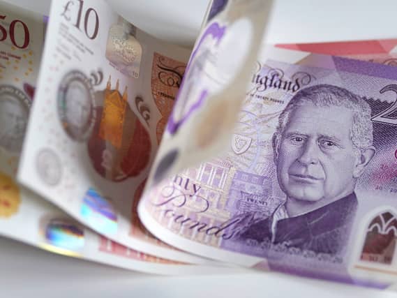 A £50, £10 and £20 note