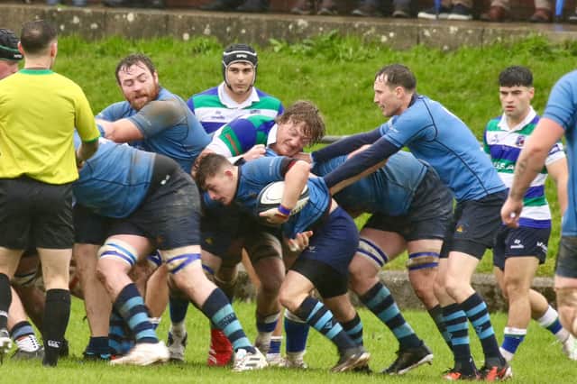 Thomas Delaney carries the ball to score Kilfeacle's first try