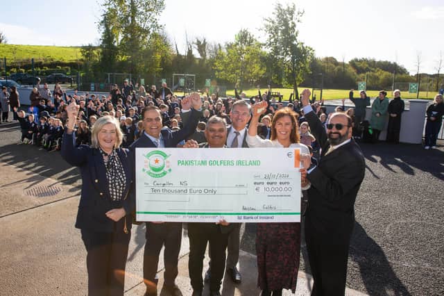Members of Pakistani Golfers Ireland with staff and pupils at Scoil Mhuire Naofa, Carrigallen.