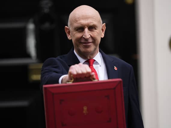 Chancellor of the Exchequer John Healey poses for photographs as he leaves 11 Downing Street, London, before delivering his first Budget to the Houses of Parliament