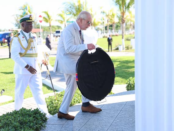 Charles laying a wreath at the Flamingo Monument