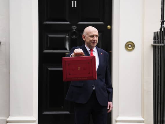 John Healey leaving No 11 Downing Street holding his red ministerial box