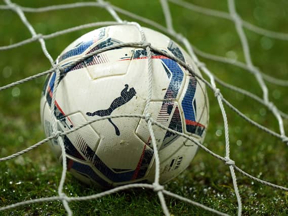 A view of a match ball in a net