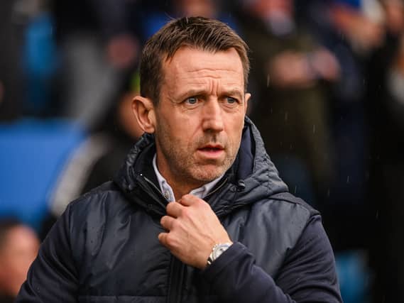 Neil McCann looks on