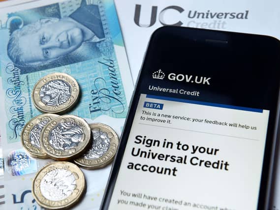 A smartphone displays a message asking the user to sign in to their universal credit account