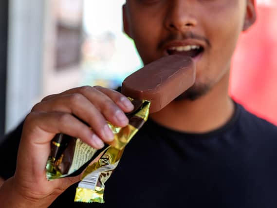 A man eating a Magnum ice cream