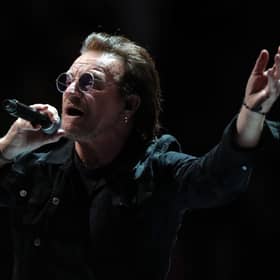 Bono performing on stage