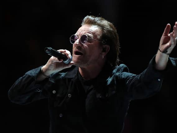 Bono performing on stage