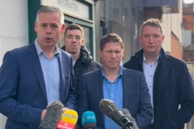 Sinn Féin's Pearse Doherty TD speaking outside PSNI station in Belfast with Matt Carthy TD