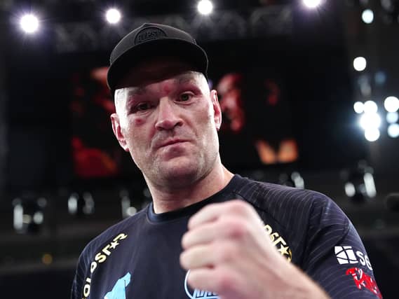 Tyson Fury raises a fist in triumph