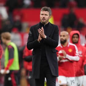 Manchester United manager Michael Carrick applauds the fans