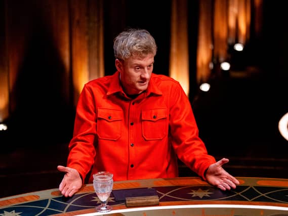 Handout photo of James Acaster on The Celebrity Traitors, wearing a red shirt
