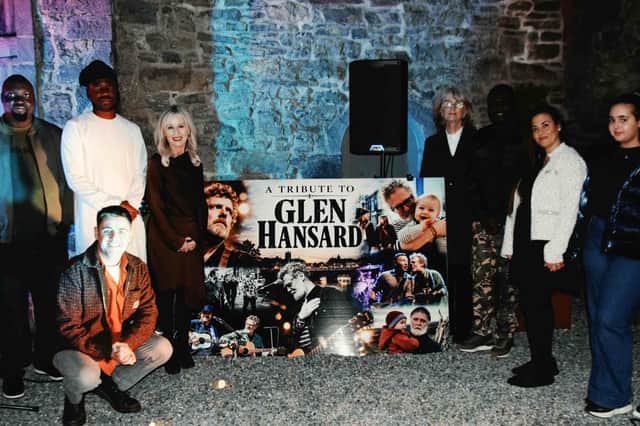 Pictured at the tribute night to Glen Hansard held in Ormond Castle courtyard were from left: Rex Alufe, Ehige Osabuchien, Kelvin Ogioba, Martina Walsh, Community Liaison Officer at Bridgewater House, kneeling Richie Delahunty, Marie Fitzpatrick, Samuel Aina, Habbia Trad and Lina Trad.