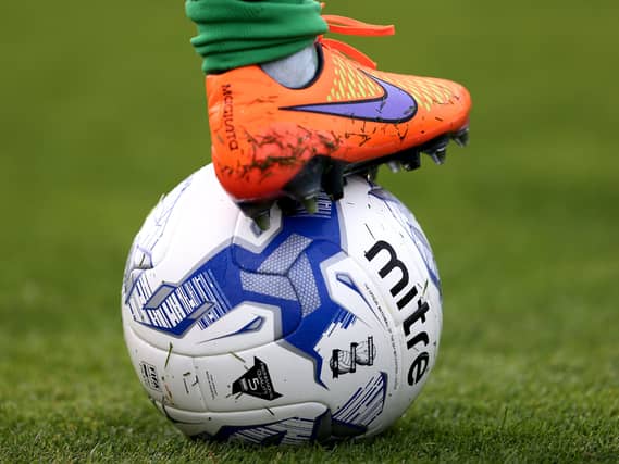 A general view of a Nike football boot on top of a football